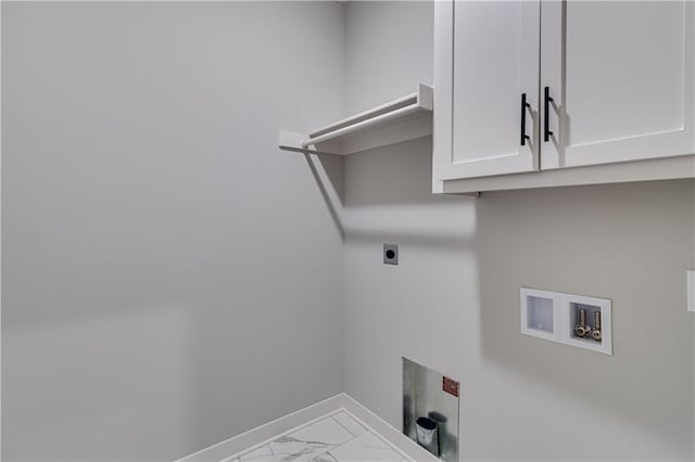 washroom with marble finish floor, hookup for a washing machine, cabinet space, hookup for an electric dryer, and baseboards