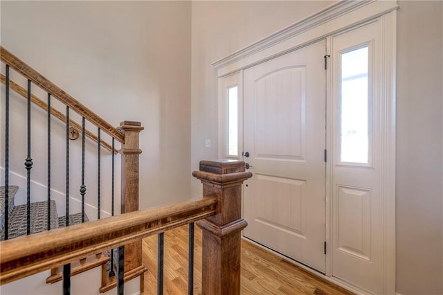 foyer with a healthy amount of sunlight and light hardwood / wood-style flooring