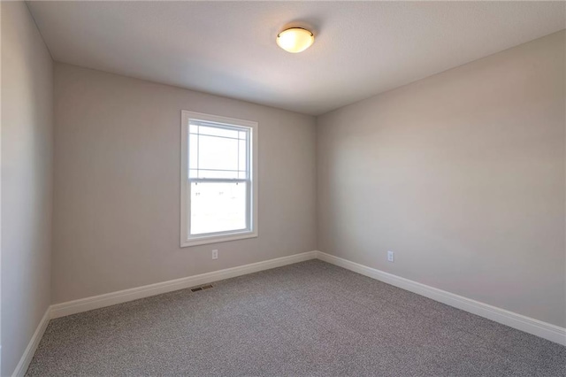 empty room featuring carpet floors