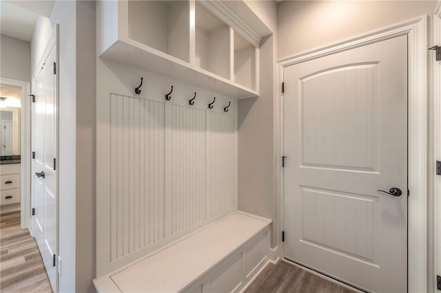 mudroom with wood-type flooring