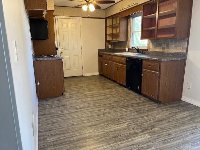 kitchen with dishwasher, sink, decorative backsplash, dark hardwood / wood-style flooring, and ceiling fan