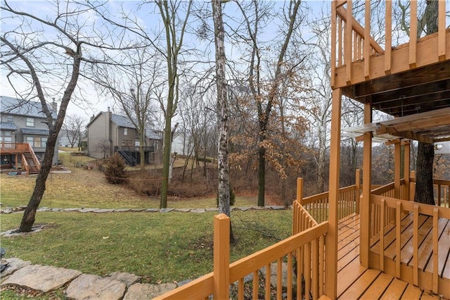 wooden terrace with a yard