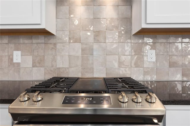 13424 W 178th St, Overland Park, KS 66013 - kitchen view of range, white cabinets, tasteful backsplash, and dark countertops