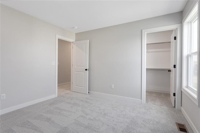 13424 W 178th St, Overland Park, KS 66013 - unfurnished bedroom with carpet floors, a spacious closet, and a closet