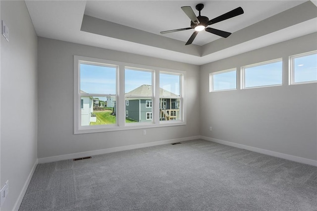 13424 W 178th St, Overland Park, KS 66013 - carpeted empty room featuring a ceiling fan and a raised ceiling