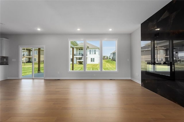 13424 W 178th St, Overland Park, KS 66013 - unfurnished living room with wood finished floors and recessed lighting
