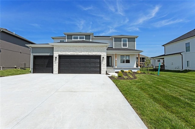 13424 W 178th St, Overland Park, KS 66013 - prairie-style house featuring concrete driveway, a front lawn, an attached garage, a porch, and stone siding