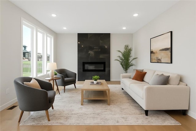 13424 W 178th St, Overland Park, KS 66013 - living room with a fireplace, light wood-style floors, and recessed lighting