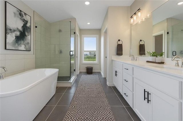 13424 W 178th St, Overland Park, KS 66013 - full bath featuring double vanity, a stall shower, a freestanding bath, tile patterned flooring, and recessed lighting