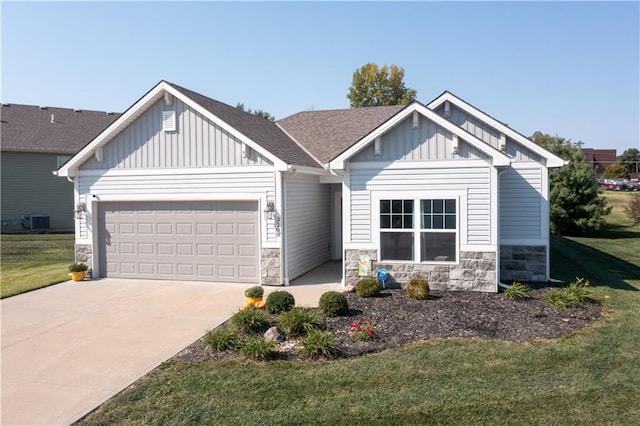 craftsman-style house with a garage, a front yard, and central AC unit