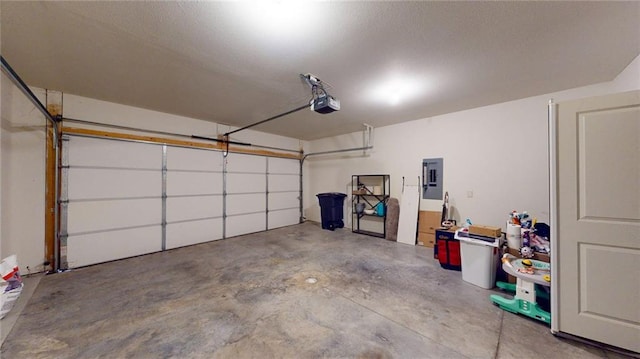 garage featuring a garage door opener and electric panel