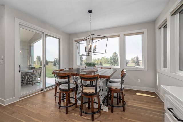 dining room featuring a chandelier and dark hardwood / wood-style floors