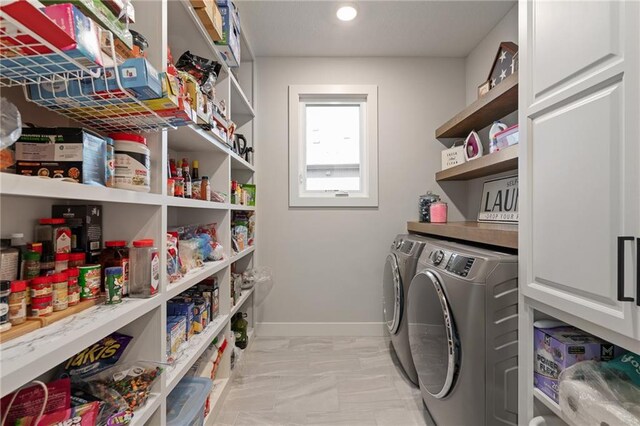 washroom with separate washer and dryer