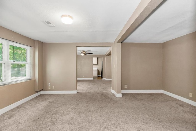 empty room featuring carpet and ceiling fan