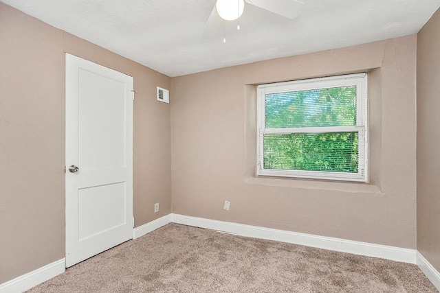 carpeted empty room with ceiling fan