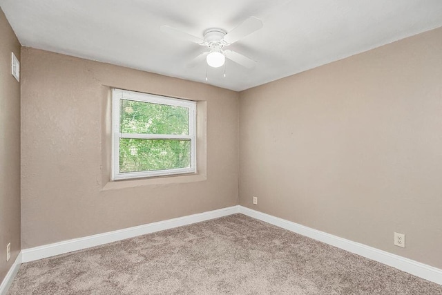 carpeted empty room with ceiling fan