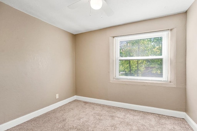 carpeted empty room with ceiling fan