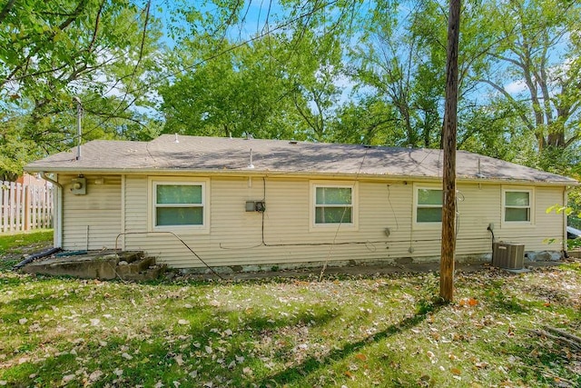 rear view of property with cooling unit