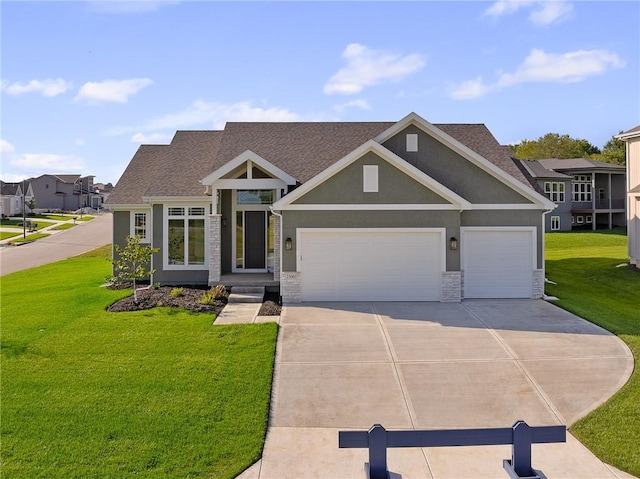 view of front of home featuring a front yard and a garage