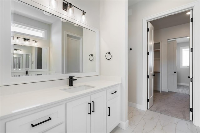 bathroom with vanity and plenty of natural light