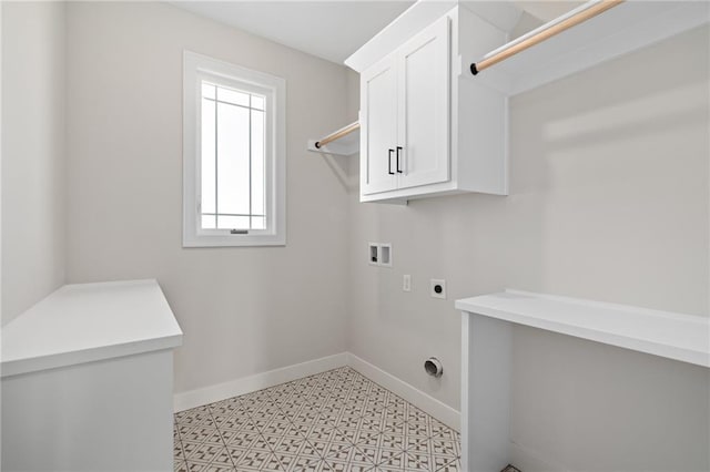 clothes washing area featuring hookup for a washing machine, cabinets, and electric dryer hookup