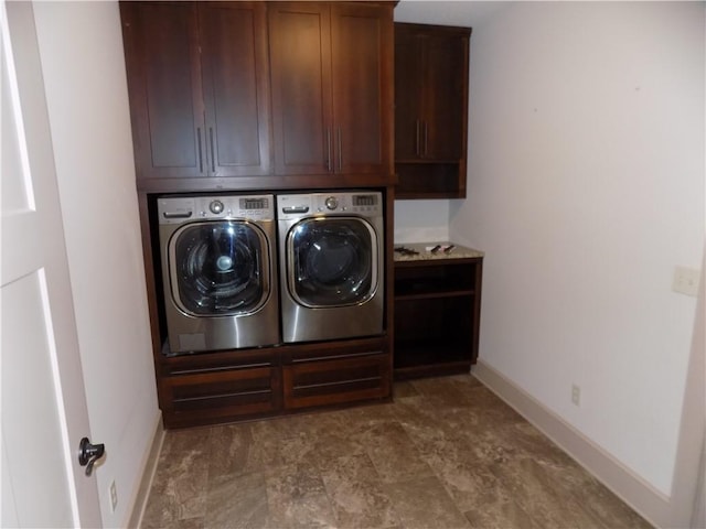 laundry area with cabinets and independent washer and dryer