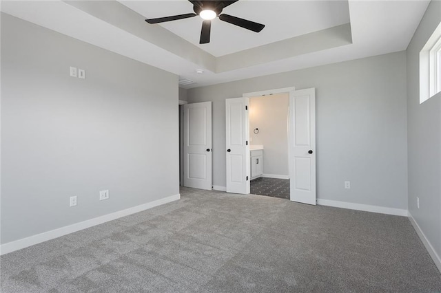 13428 W 178th St, Overland Park, KS 66013 - unfurnished bedroom featuring carpet floors, a raised ceiling, and connected bathroom