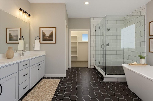 13428 W 178th St, Overland Park, KS 66013 - bathroom with a stall shower, double vanity, a freestanding tub, recessed lighting, and tile patterned floors