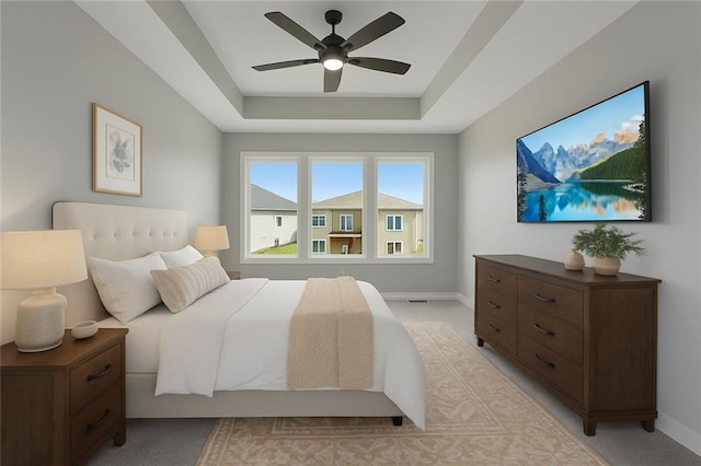 13428 W 178th St, Overland Park, KS 66013 - bedroom featuring light carpet, a raised ceiling, and a ceiling fan