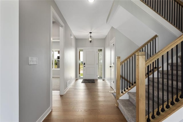 13428 W 178th St, Overland Park, KS 66013 - entrance foyer featuring wood-type flooring and stairs