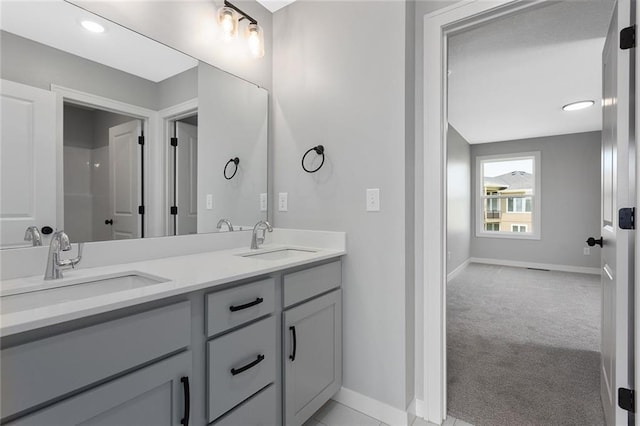 13428 W 178th St, Overland Park, KS 66013 - bathroom featuring baseboards and double vanity