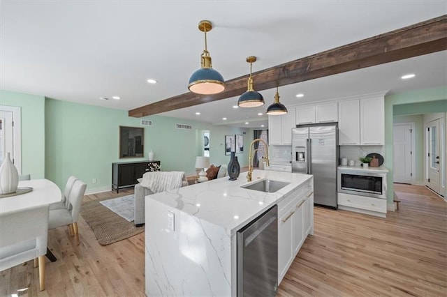 8301 Lee Blvd, Leawood, KS 66206 - kitchen with light wood-style flooring, beam ceiling, stainless steel appliances, beverage cooler, and a sink