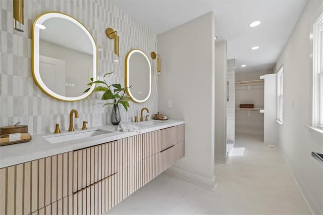 8301 Lee Blvd, Leawood, KS 66206 - full bath featuring recessed lighting, double vanity, baseboards, and a sink