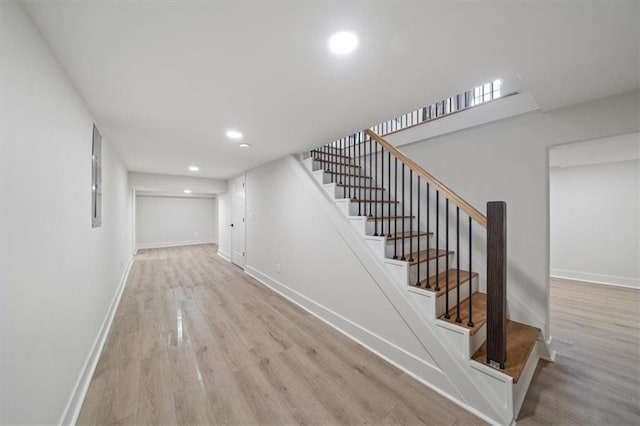 8301 Lee Blvd, Leawood, KS 66206 - stairs featuring wood finished floors, baseboards, and recessed lighting