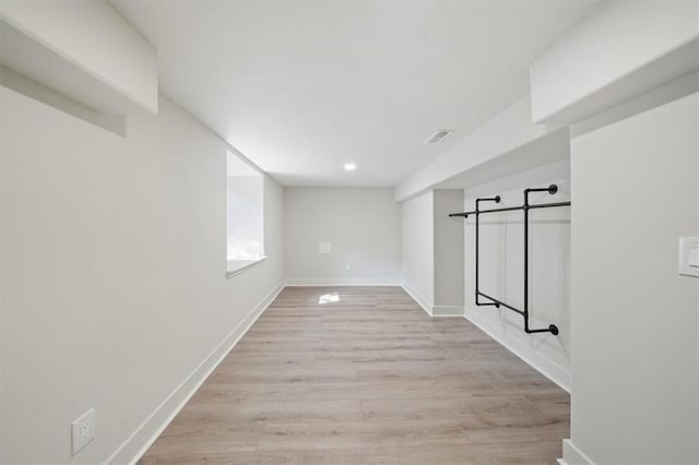 8301 Lee Blvd, Leawood, KS 66206 - below grade area featuring light wood finished floors, baseboards, visible vents, and recessed lighting