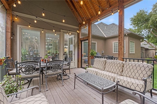 deck featuring an outdoor living space and outdoor dining space