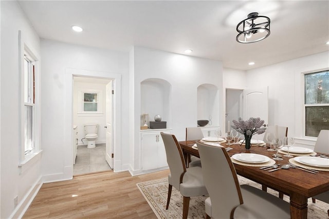 dining area with light hardwood / wood-style flooring