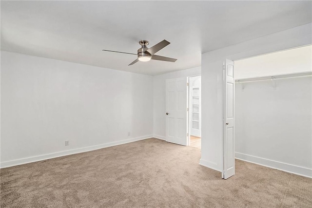 unfurnished bedroom with ceiling fan, a closet, and light colored carpet