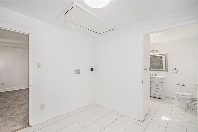 washroom featuring light tile patterned floors and washer hookup