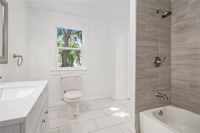 full bathroom featuring tile patterned flooring, vanity, tiled shower / bath combo, and toilet