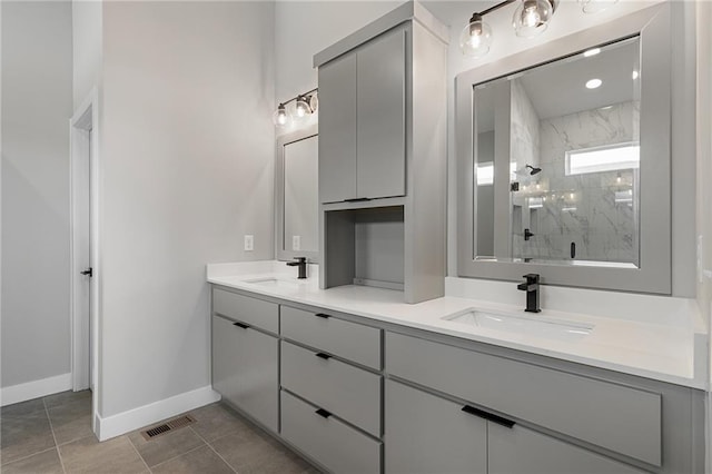 bathroom featuring vanity, tile patterned floors, and an enclosed shower