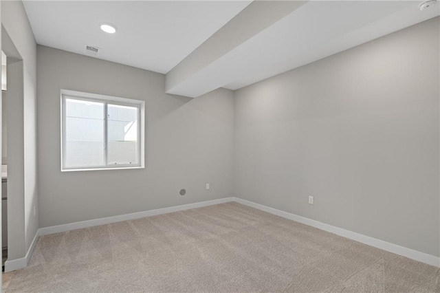 empty room featuring light colored carpet