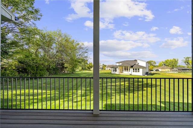 wooden terrace with a yard