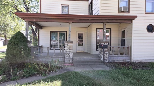 entrance to property featuring a porch