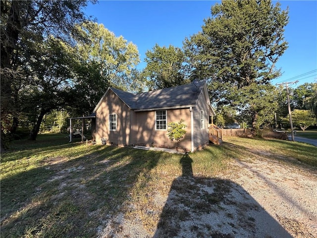 view of property exterior featuring a lawn