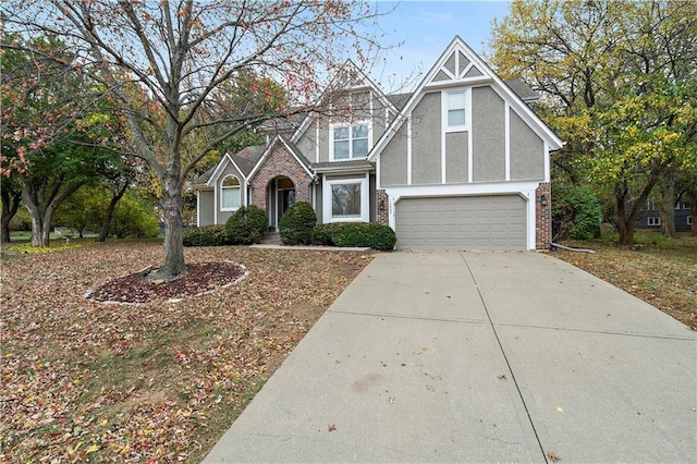 tudor-style house with a garage