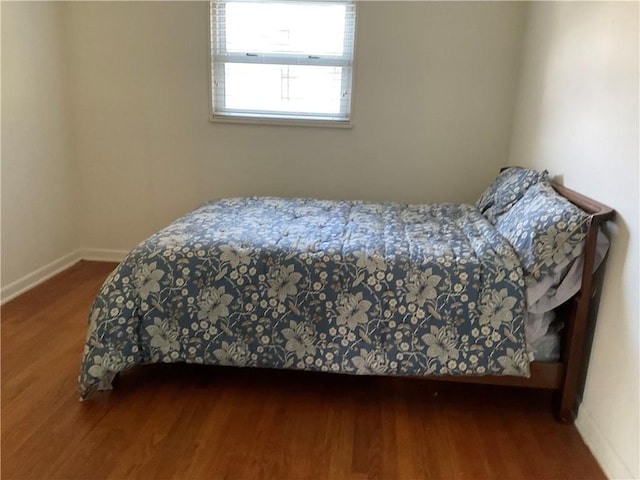 bedroom featuring hardwood / wood-style floors