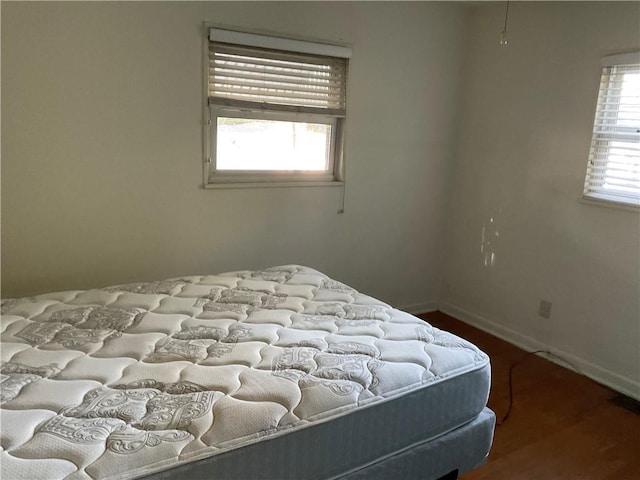 bedroom featuring wood-type flooring