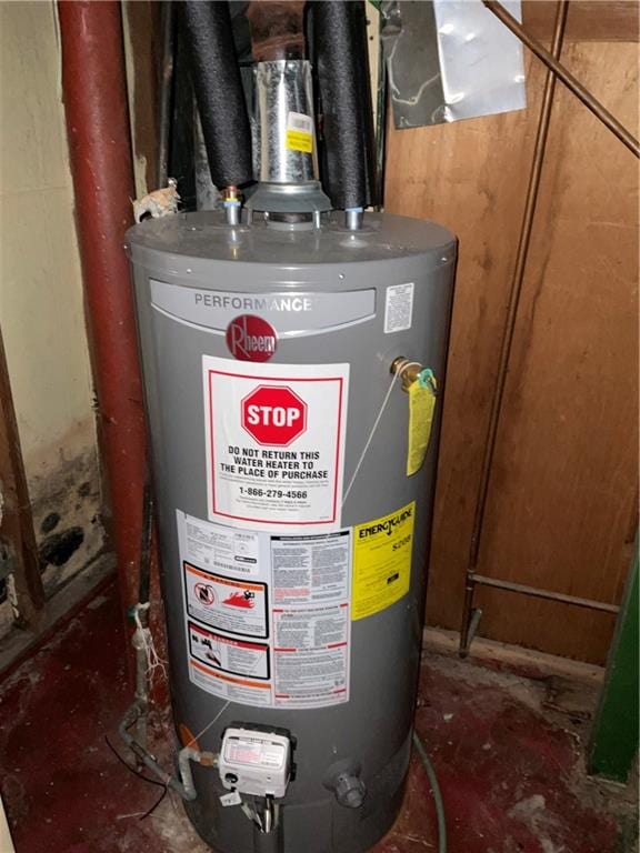 utility room featuring water heater