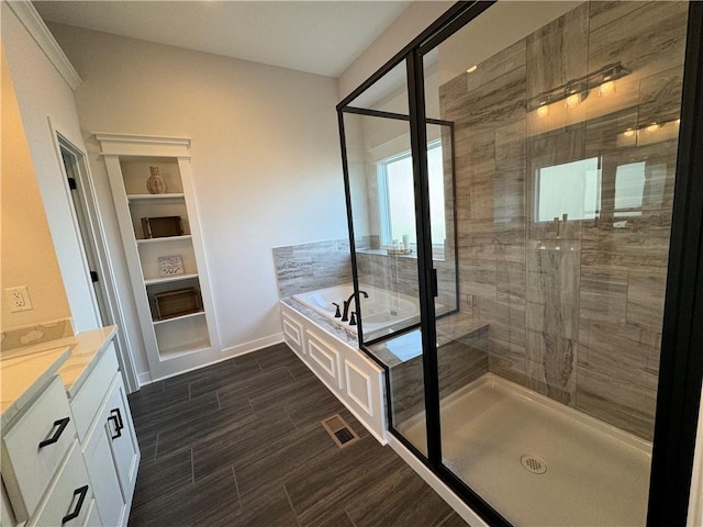 bathroom with plus walk in shower and vanity